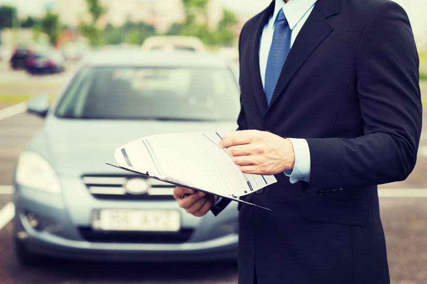 guy with car buying documents