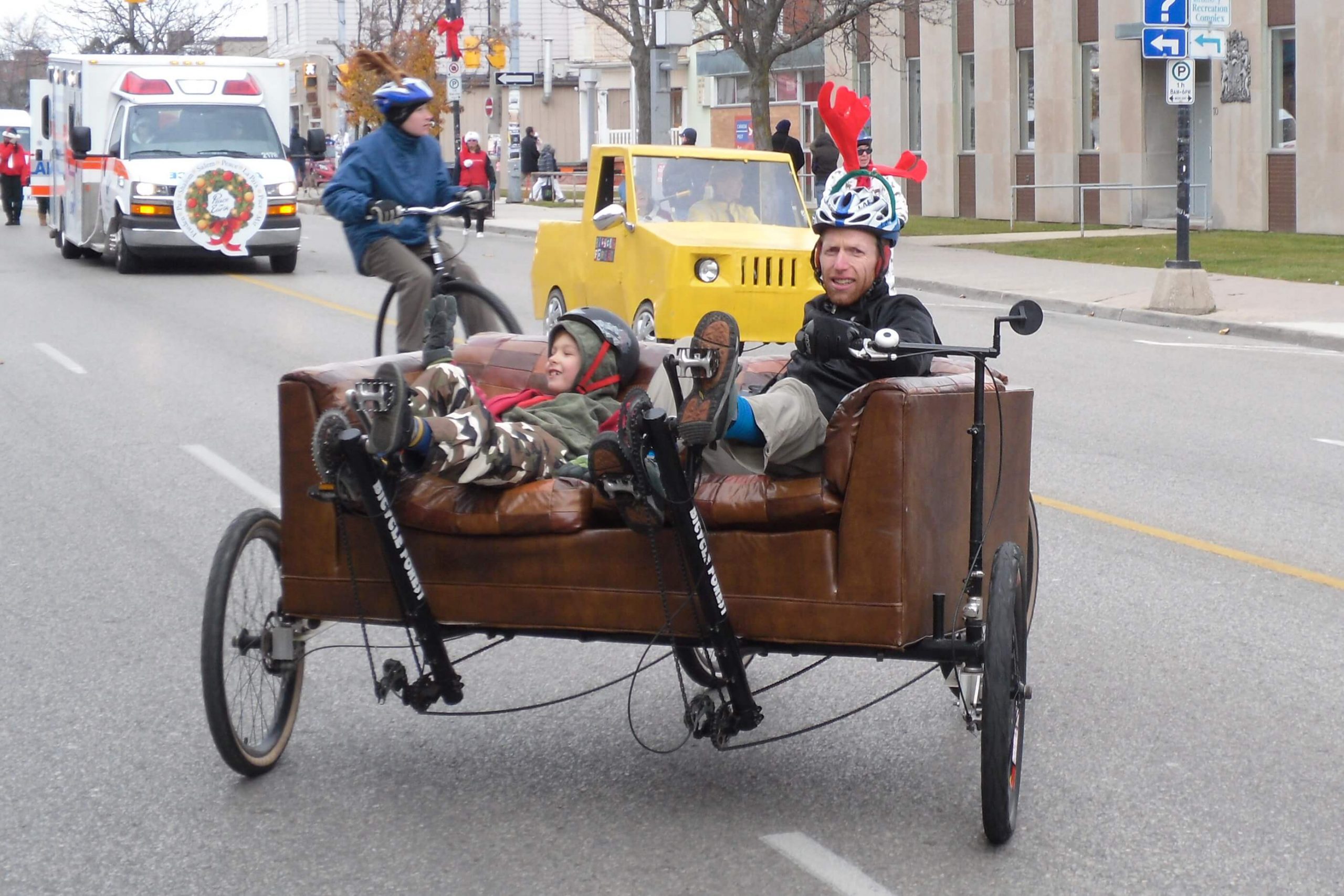 father and son travelling on couchbike