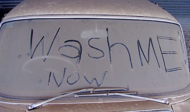 dirty car rear windshield full of dust