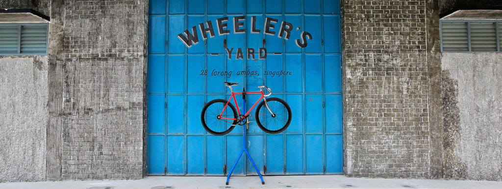 bicycle infront of the famous wheeler's yard doors in Singapore