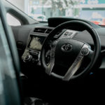 Steering wheel and dashboard of a Toyota Prius Plus