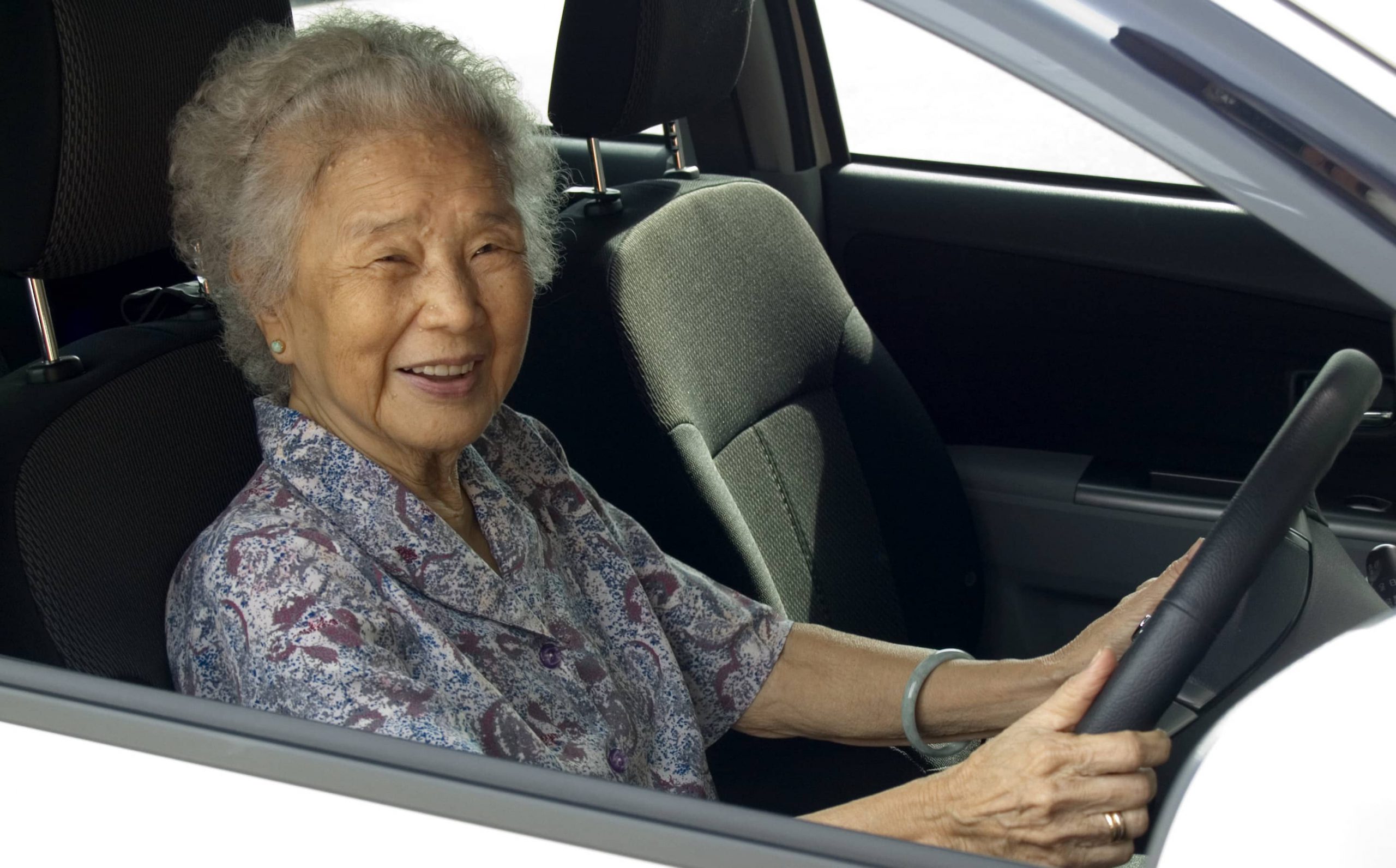 Woman over 65 driving to renew license