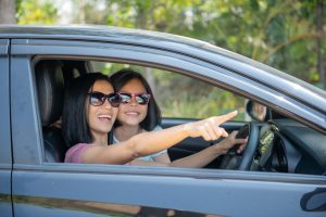 Mother and daughter driving